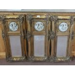 Three gilt mirrors with relief cherub decoration