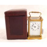 A cased Brass carriage clock and key