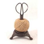 A Victorian style cast iron string holder with scissors