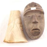 An African bone carving plus a Sierra Leone mask