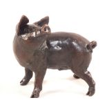 A limited edition solid Bronze figure of a pig,