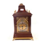 An Edwardian Mahogany and Brass mounted bracket clock with silvered chapter ring and fusee movement,