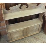 An Edwardian Pine hanging shelf with cupboard