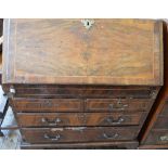 A George II Walnut bureau with interior well