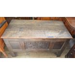 An 18th Century Oak coffer with leaf carved panel