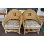 Two conservatory cane chairs and table
