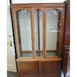 A Mahogany glazed two door display cabinet with glass shelves