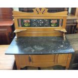 An Edwardian Satinwood and black marble washstand with Art Nouveau copper and tiled back