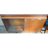 A 1970's bookcase and cupboard