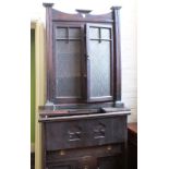 A glazed oak cupboard bookcase