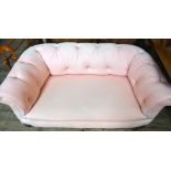 A Victorian pink upholstered buttonback Chesterfield sofa