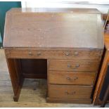 An Oak kneehole bureau and occasional table