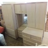 A modern combination six piece bedroom suite, comprising two wardrobes, dressing table,