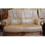 A modern brown upholstered leather two seat sofa and electric reclining armchair