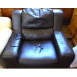 A brown leather upholstered electric armchair