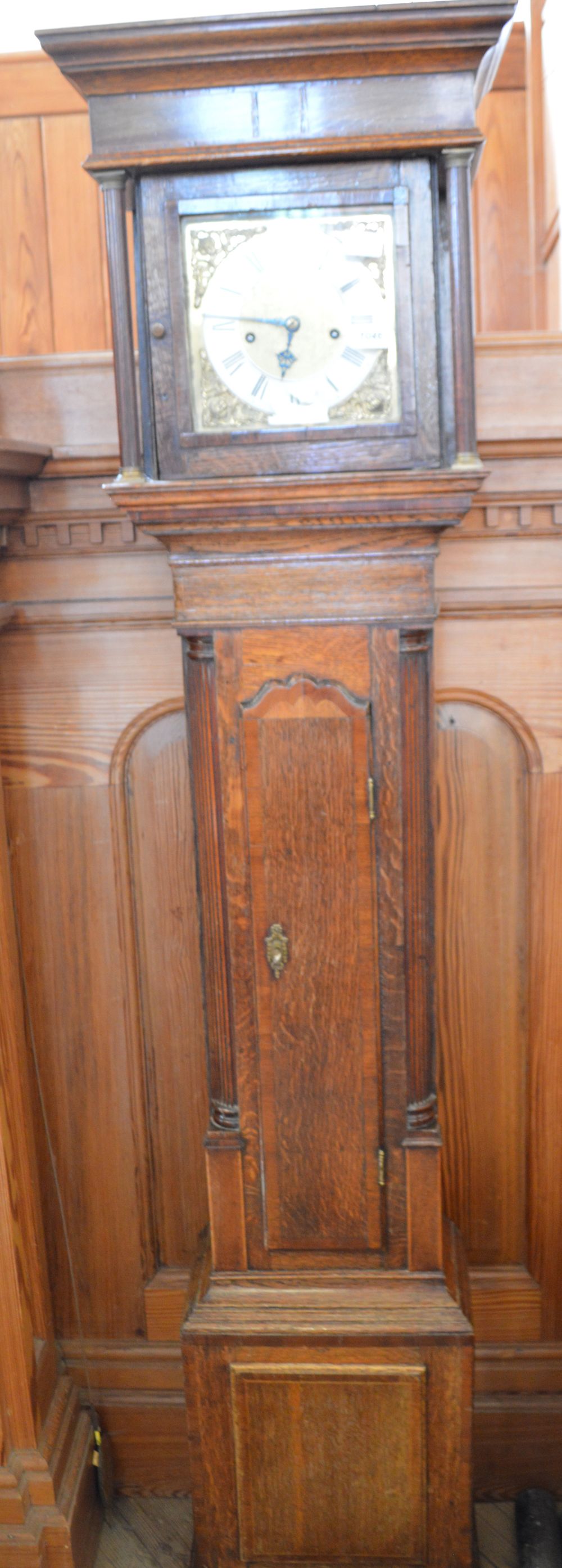 A 19th Century Oak and Mahogany cross banded longcase clock with silvered chapter ring and brass