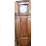 A 19th Century Oak and Mahogany cross banded longcase clock with silvered chapter ring and brass