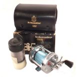 An Abu Ambassadeur 6500C multi reel in original box, leather case,