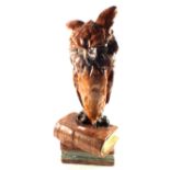 A large pottery grotesque Owl (repaired),