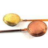 Two antique Copper and Brass warming pans each with turned wooden handles