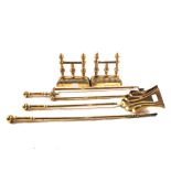 An embossed Brass log box, a set of three Brass fire irons, a pair of fire dogs,