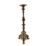 A large late 19th Century Bronze pricket candlestick with wide drip tray,