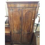 A 19th Century continental figured Mahogany two door wardrobe