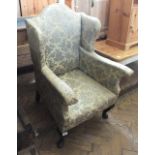 A wingback cabriole leg armchair