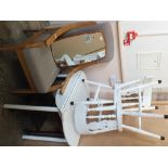 Two white painted chairs, a table, a tea trolley,
