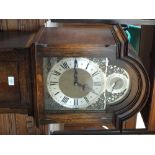 A reproduction Oak longcase clock with Westminster,