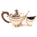 A Silver teapot and cream jug,