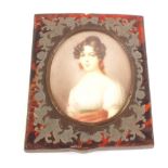 A 19th Century miniature half length portrait of a lady in a tortoiseshell frame