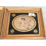 A pair of Georgian oval silkwork pictures, Seated Girl and Boy,