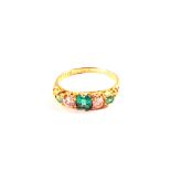 An Emerald and Diamond set five stone ring, square cut Emeralds and Diamonds set inbetween,