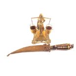 A Brass milkmaid and a dagger with decorative grip