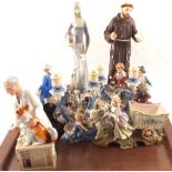 Various continental porcelain figurines plus a figure of St Francis and a Royal Doulton "Thanks
