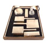 A cased Silver dressing table set,