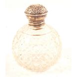 A Silver top glass perfume bottle,