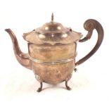 A Silver teapot with wavy edge on four feet with inscription, slight rub marks,