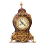 A French Boulle striking mantel clock in waisted case