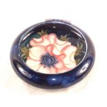 A Moorcroft Anemone pattern pin dish on blue ground with marks to base