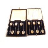 Two cased sets of six Silver coffee spoons,