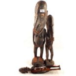 Two New Guinea tribal carvings plus one Easter Island figure