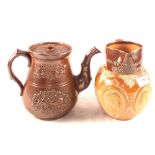 A Doulton Lambeth 1897 Jubilee stone jug and a 19th Century salt glazed relief decorated teapot