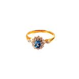 A 9ct Gold Topaz and Diamond cluster ring,