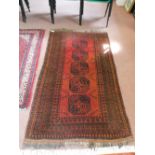 An Afghan rug with five central medallions,