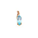 An oval shaped large Blue Topaz pendant mounted in 9ct Gold with small Diamonds