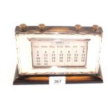 A Silver fronted calendar,