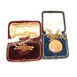 A selection of Gold and yellow metal jewellery to include a 9ct Gold Seed Pearl and Garnet brooch,