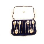 A cased set of six Silver Apostle spoons and tongs,